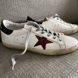 Golden goose woman’s super-star low top sneakers.